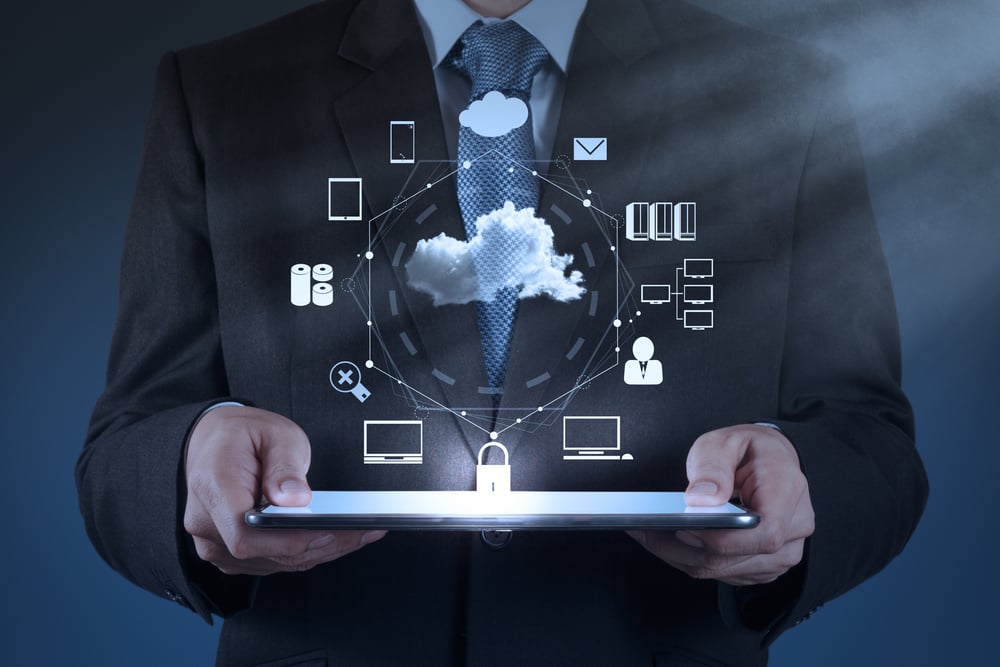 Businessman hand working with a Cloud Computing diagram on the new computer interface as concept